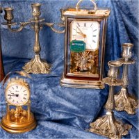 Different styles of large clocks and candle sticks