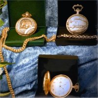A close-up of different styles of pocket watches
