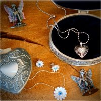 Small jewelry boxes and also some necklaces, earrings, and fairy decorations
