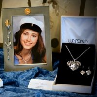 Silver necklaces and earrings and a graduation photo frame