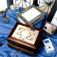 A necklace, a ring, some fairies, a photo album, and also different styles of jewelry boxes, photo frames, clocks, and other gift products